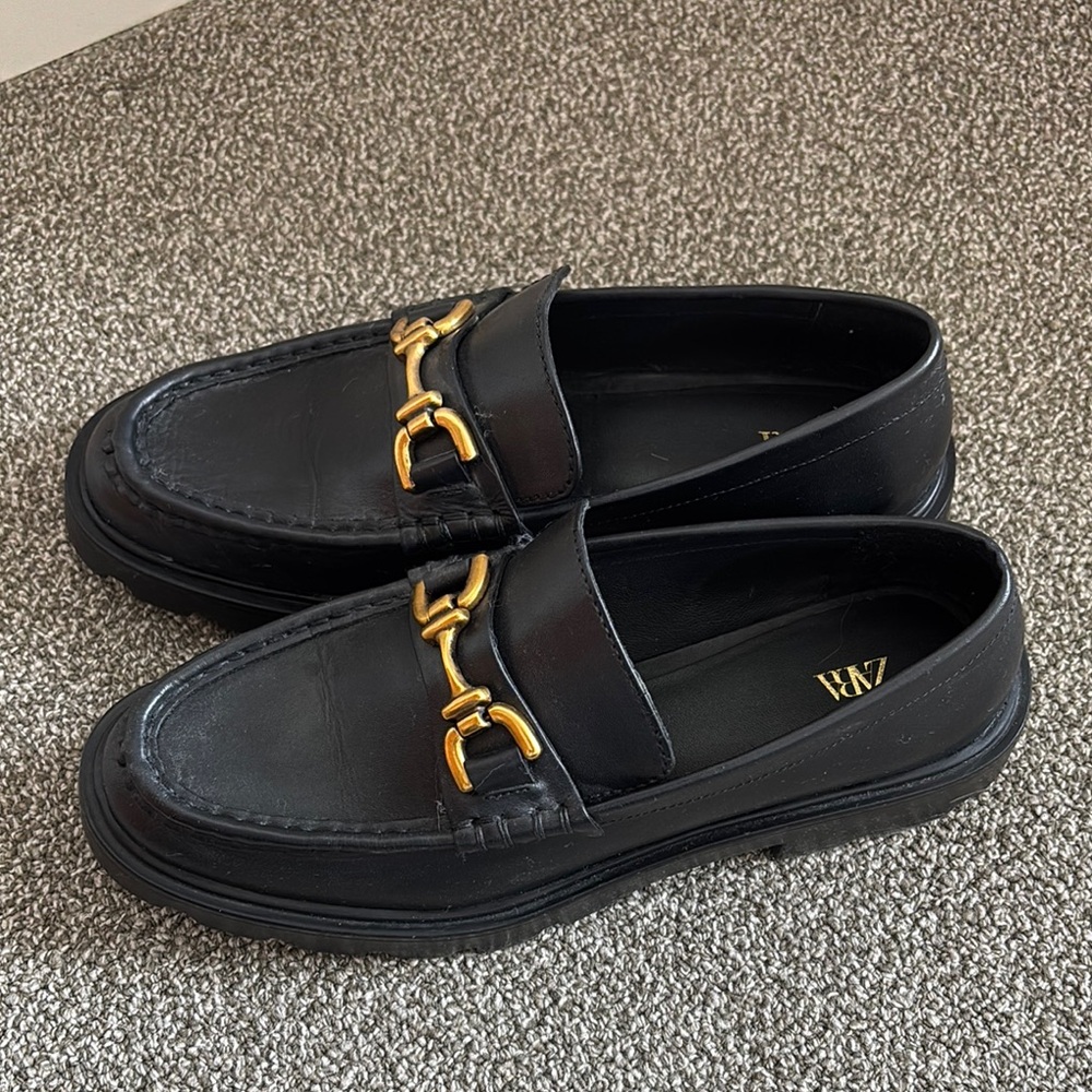 Black Loafers with Gold Detailing